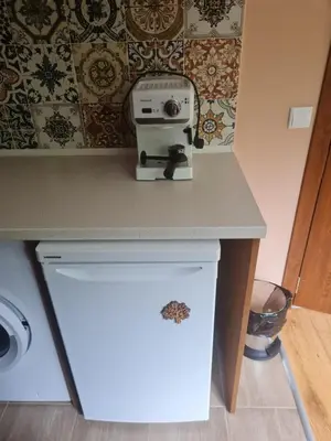 a sewing machine sitting on a counter in a kitchen at Cozy apartment with balcony in Sofia