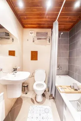 a bathroom with a toilet and a sink and a shower at Bansko Best View Apartment in Bansko