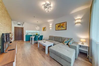 a living room with a couch and a table at OAK PARADISE in Smolyan