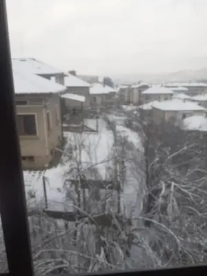 a view from a window of a village in the snow at Apartment Ceco in Troyan