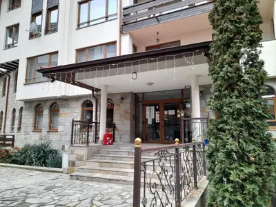 a building with a staircase leading to the entrance at SNOW PEAK TODORKA AND VIHREN APARTAMENT /NEXT TO THE LIFT/ 7 PERSONS/ in Bansko