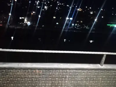 a view of a city at night with lights at Кръчмъ При Байката апарт in Teteven