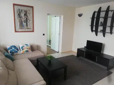 a living room with a couch and a table at Апартамент ВалАнди in Samokov