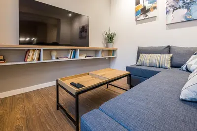 a living room with a couch and a coffee table at North 21 - Brand New Modern 1BD Apt in Sofia Center by Flat Mаnager in Sofia
