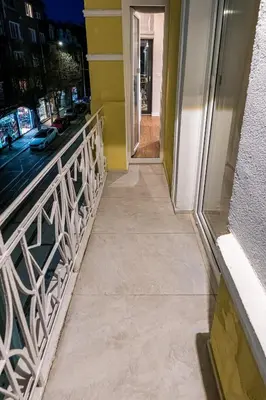 a walkway leading to a building with a balcony at North 21 - Brand New Modern 1BD Apt in Sofia Center by Flat Mаnager in Sofia