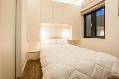 a white bed in a room with a window at South 22 - Brand New Modern 1BD Apt in Sofia Center by Flat Mаnager in Sofia