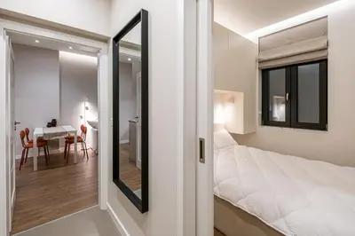 a bedroom with a bed and a dining room at South 22 - Brand New Modern 1BD Apt in Sofia Center by Flat Mаnager in Sofia