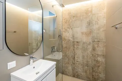 a bathroom with a sink and a mirror at South 22 - Brand New Modern 1BD Apt in Sofia Center by Flat Mаnager in Sofia