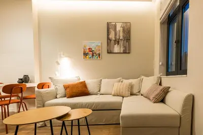 a living room with a couch and a table at South 22 - Brand New Modern 1BD Apt in Sofia Center by Flat Mаnager in Sofia