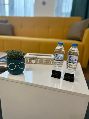 two bottles of water sitting on top of a table at Stracciatella Homes Apartment in Sofia