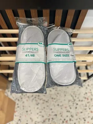 two packages of white towels sitting on a shelf at Stracciatella Homes Apartment in Sofia