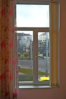 a window with a view of a street at INB Iconic Spot in Sofia
