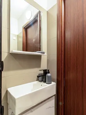 a bathroom with a sink and a mirror at Skyline Studio - Sofia Center in Sofia