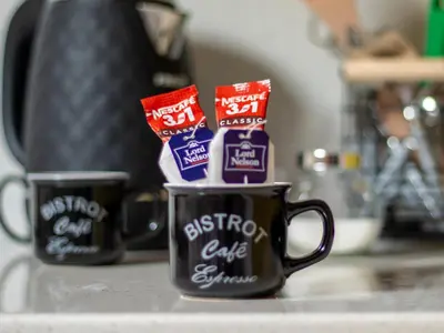 two coffee cups filled with different types ofalted butter at Vazov Loft - Central Sofia Studio in Sofia
