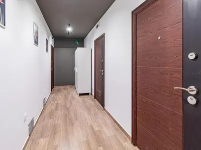 an empty hallway with a door and a refrigerator at Nevsky Loft - Central Sofia Studio in Sofia