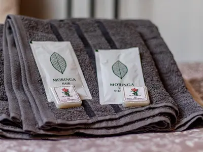 three pieces of soap on a towel on a table at Serdika Loft - Central Sofia Studio in Sofia