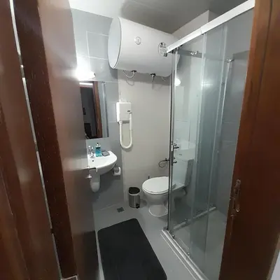 a bathroom with a shower and a toilet and a sink at lux Apartament L201 in Bansko