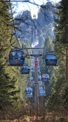 a group of cars on a ski lift at lux Apartament L201 in Bansko