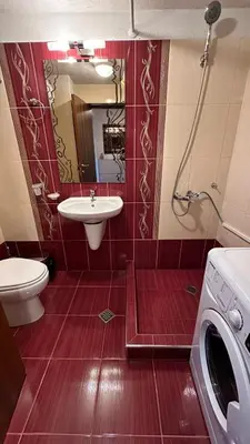 a bathroom with a sink and a washing machine at Ioannis Apartment Bansko in Bansko