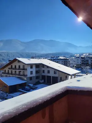 a view of a building with snow on the roof at KS Rooftop 180° in Bansko