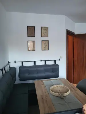 a living room with a couch and a table at KS Rooftop 180° in Bansko