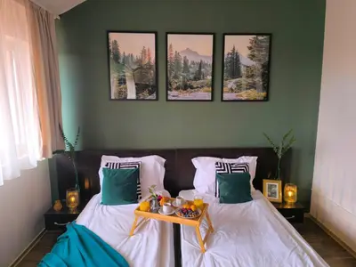 a bedroom with two beds with a tray of fruit on it at Happy Stay 100mfrom Gondola with free Bottle of Wine and free Parking in Bansko