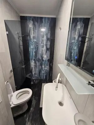 a bathroom with a white sink and a toilet at Studio Apartament 47А- Trakia 54 А in Plovdiv