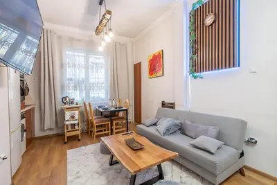 a living room with a couch and a table at Vintage Home by NDK and Vitosha Blvd with Free Secured Parking in Sofia