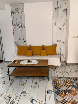 a living room with a couch and a coffee table at 2 Bedrooms apartment. in Plovdiv