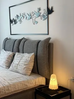 a living room with a couch and a picture on the wall at 3 BR Apt, Spacious, Near South Park in Sofia