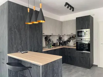 a kitchen with a wooden counter and a stove top oven at 3 BR Apt, Spacious, Near South Park in Sofia