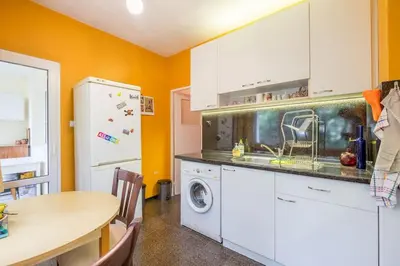 a kitchen with a washing machine and a table at Beautiful Flat in Central Location by Flat Mаnager in Sofia