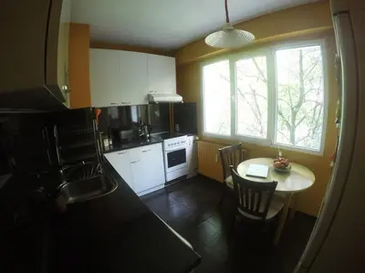 a small kitchen with a table and a window at Beautiful Flat in Central Location by Flat Mаnager in Sofia