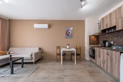 a living room with a couch and a table at Cozy Homes 3 in Sofia