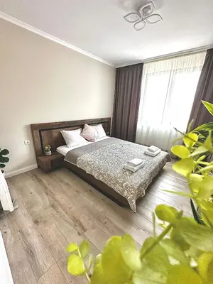 a bedroom with a bed and a large window at View in Petrich