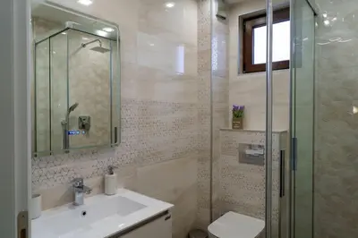 a bathroom with a sink and a shower at View in Petrich