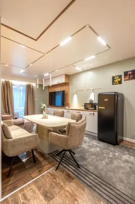 a kitchen with a table and a refrigerator in a room at Bansko Getaway- Ski & Summer Activities , sleep 6 in Bansko