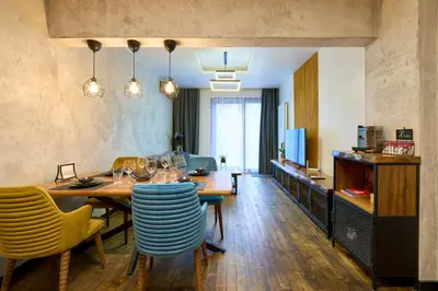 a dining room with a table and chairs at Luxury 2 Bedroom Apartment - Private Garden in Sofia