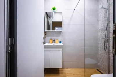 a bathroom with a sink and a shower at Bright and Cosy 1BD Flat - Perfect for Business Trip by Flat Mаnager in Sofia