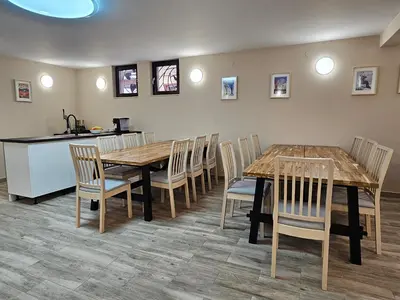 a dining room with a table and chairs at Villa Geronimo in Bansko