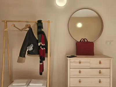 a dressing room with a mirror and a dresser at Villa Geronimo in Bansko