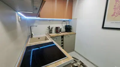 a small kitchen with a sink and a stove at Very cozy and comfort house in top location in Bansko