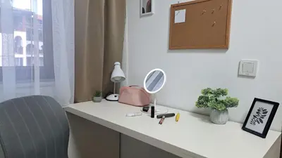 a white desk with a mirror and a chair at Very cozy and comfort house in top location in Bansko