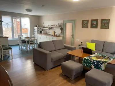a living room with a couch and a table at NiDo Cozy 3BR Apartment Kapana Top Center in Plovdiv