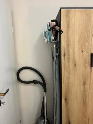 a room with a hair dryer plugged into a wall at Elizi1winter apartments Pamporovo in Pamporovo