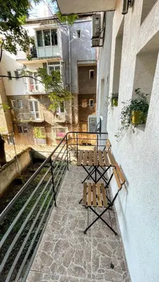 a bench sitting on the side of a building at Bohemian Central Apartment Sofia in Sofia