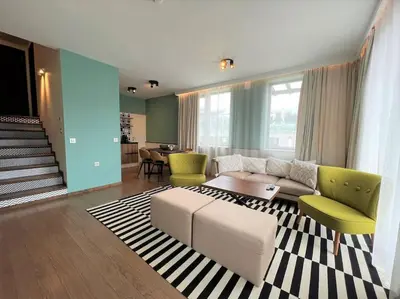 a living room with a couch and a table at Private Villa in Ruskovets in Dobrinishte