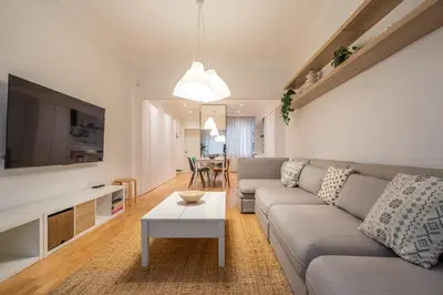 a living room with a couch and a table at The Griffin in Sofia