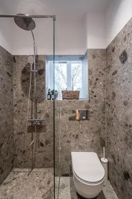 a bathroom with a toilet and a glass shower at The Griffin in Sofia