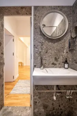 a bathroom with a sink and a mirror on the wall at The Griffin in Sofia